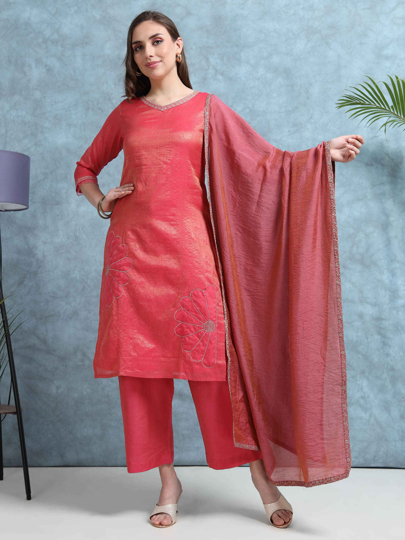 Woman wearing a red traditional outfit with a dupatta against a blue background