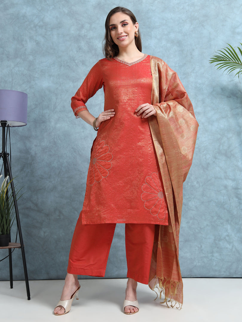 Woman wearing a red traditional outfit with a dupatta against a blue background