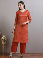 Load image into Gallery viewer, Woman wearing a red kurta with palazzo pants against a gray background